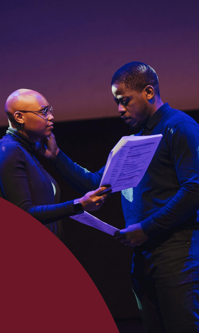 Two actors rehearsing on stage