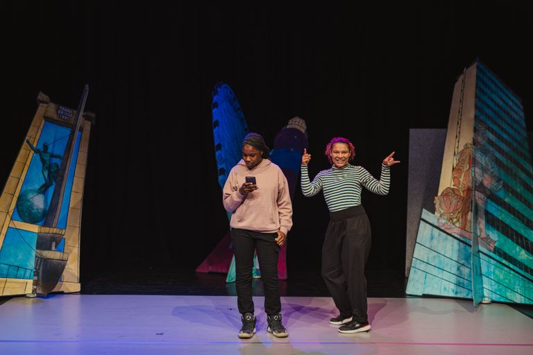 Image of actors performing on stage