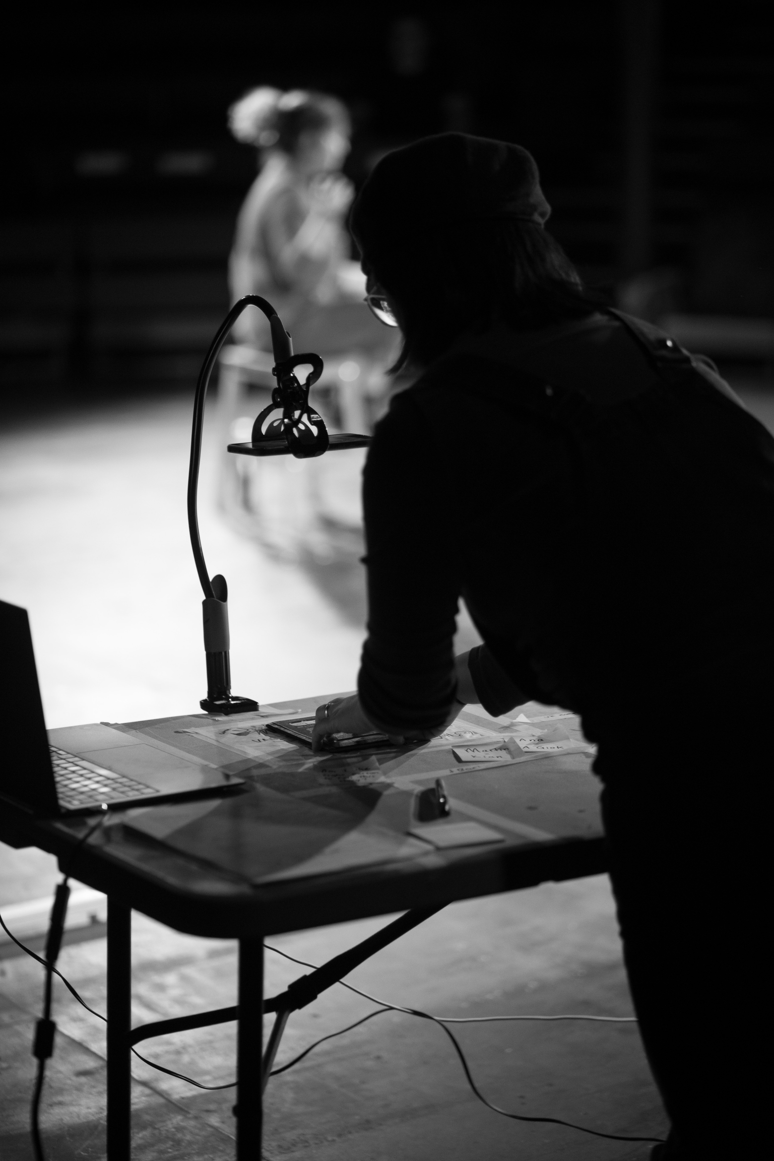 A woman works at a table